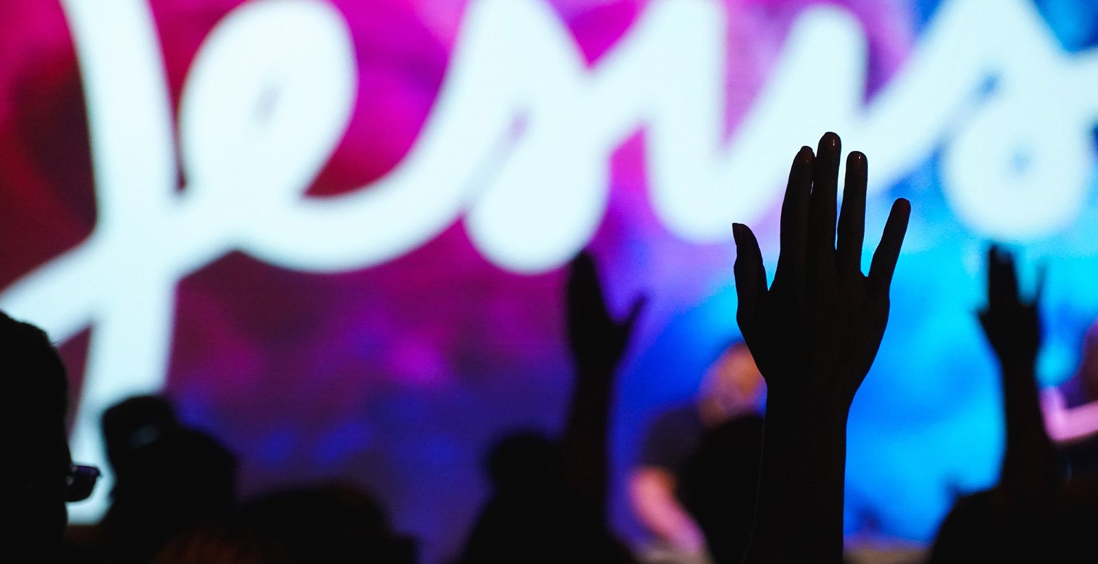 Worshippers raising their hands during a service