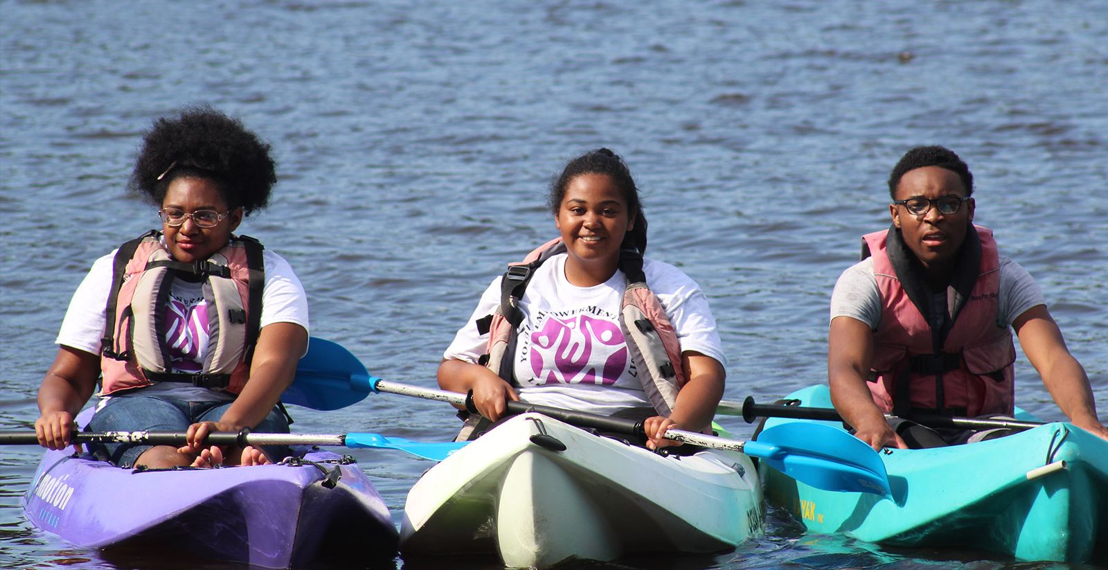 Campers kayaking on the water at Life Matters Camp
