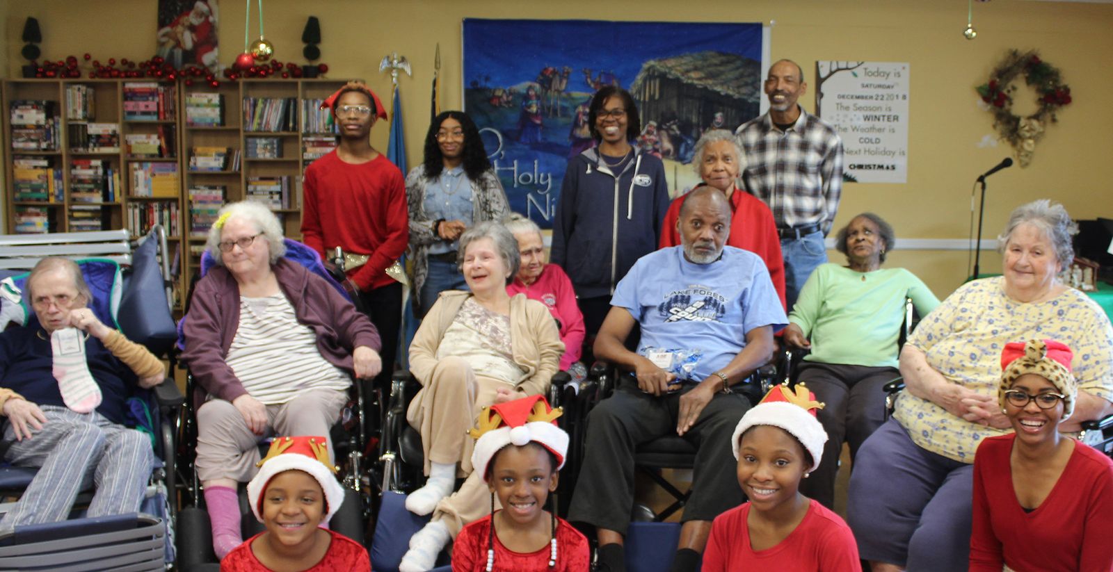 Church members visiting residents at the nursing home during the holidays